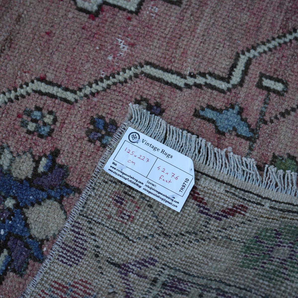 Pink 4' x 7' Turkish authentic vintage rug from the 1970s with traditional design.