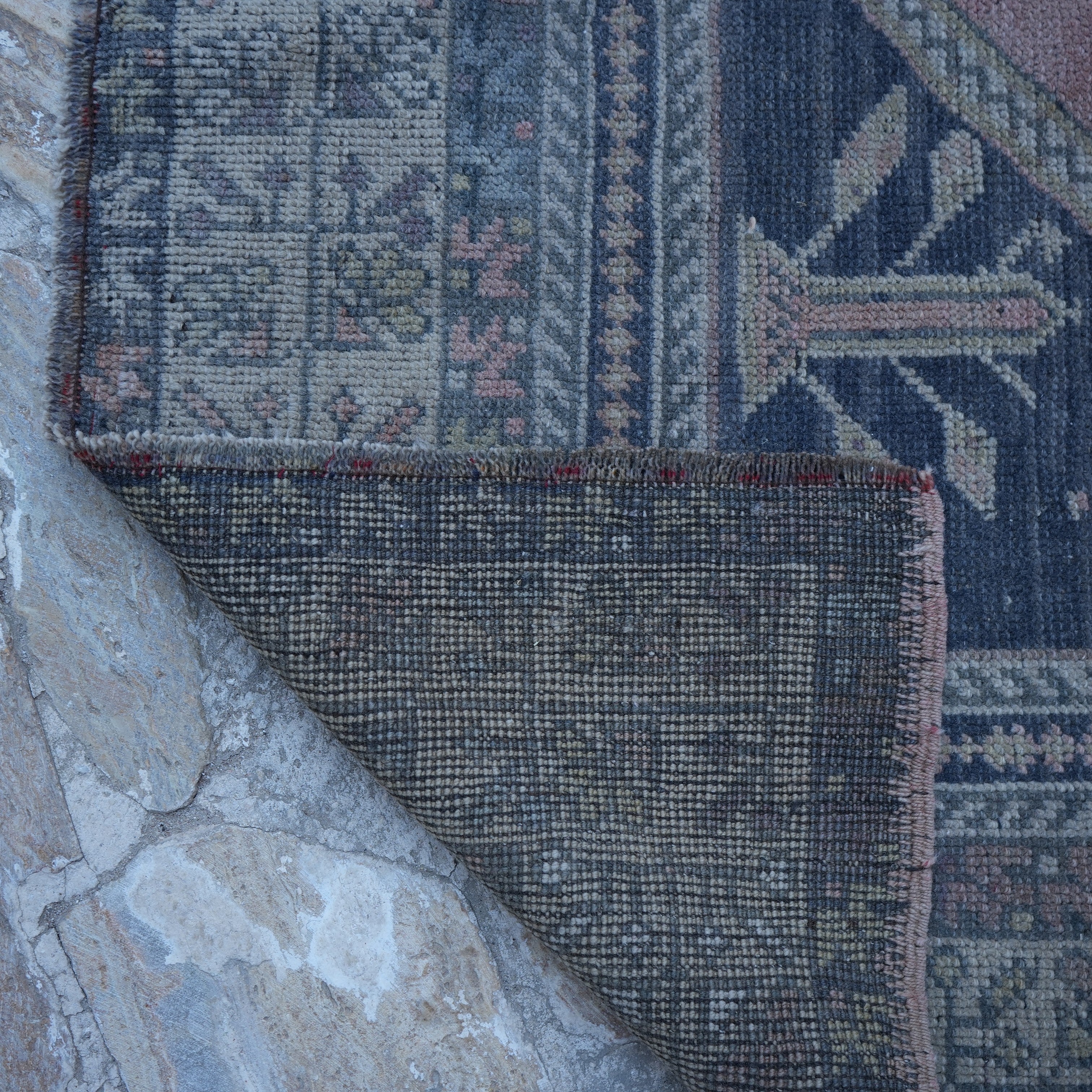 1970s pink Turkish authentic vintage rug with traditional design, hand-knotted weave and low pile.