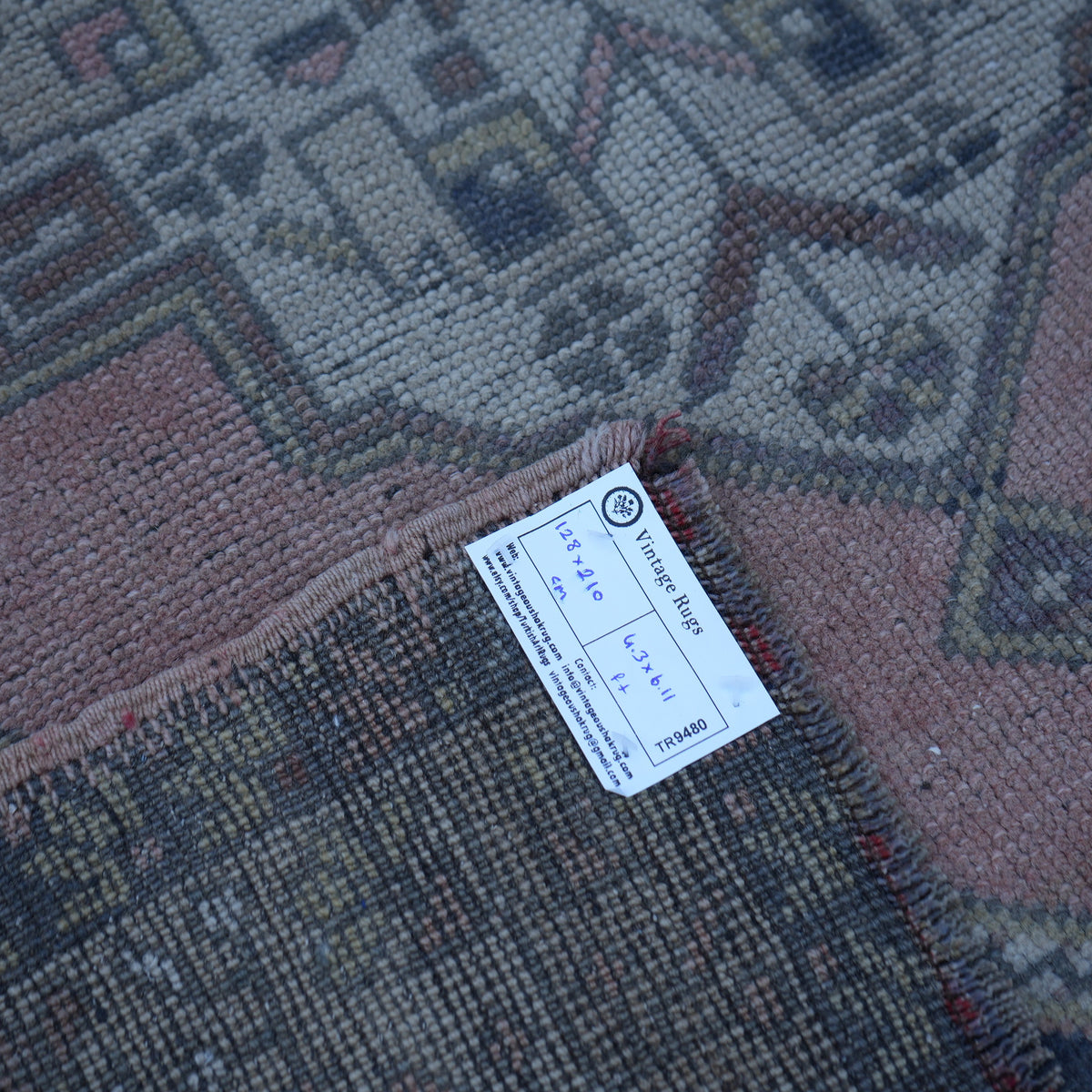 Pink 4' x 7' Turkish authentic vintage rug from the 1970s with traditional design.