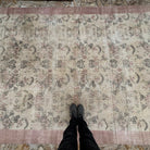 1970s beige Turkish authentic vintage rug with floral design, hand-knotted weave and low pile.
