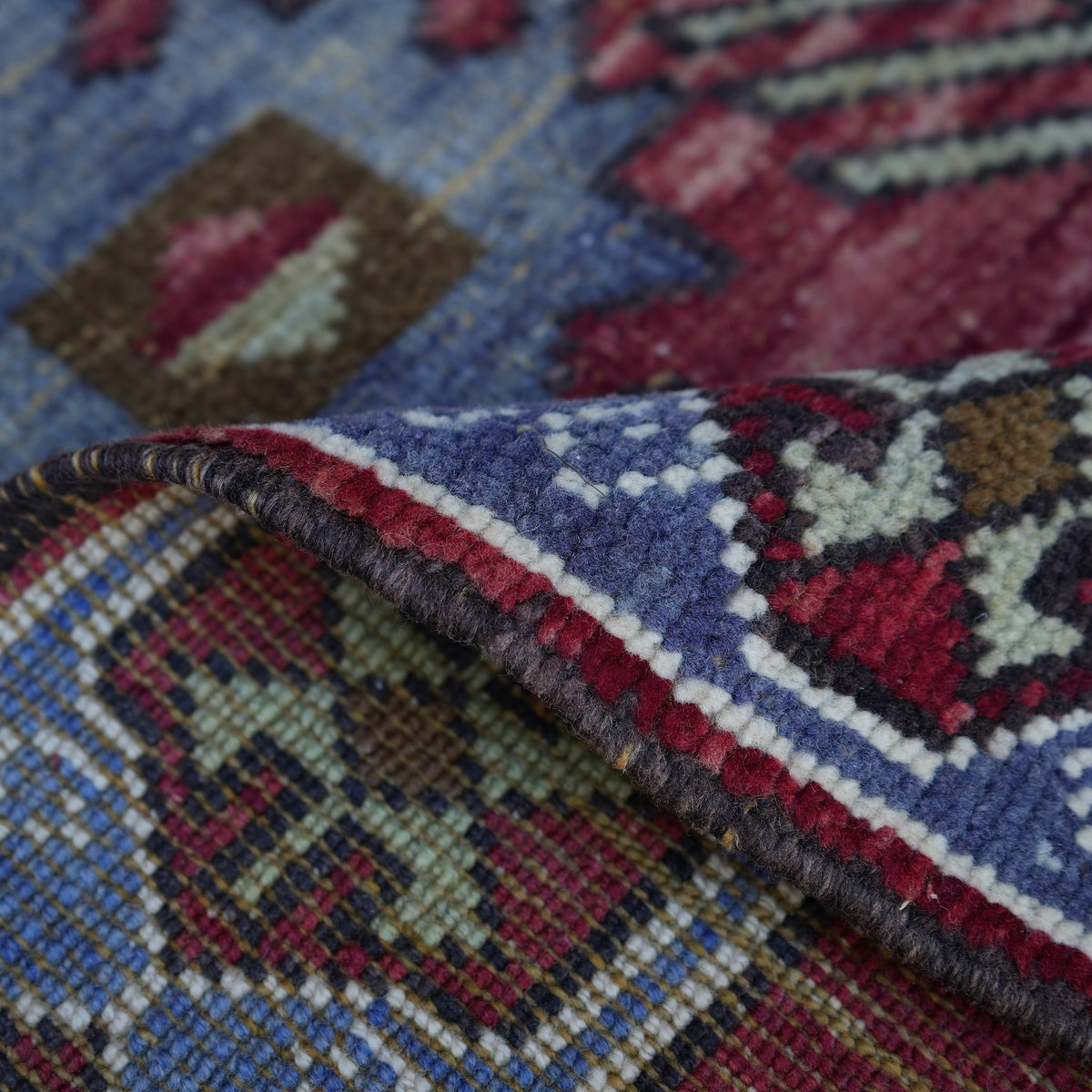 1970s red Turkish authentic vintage rug, hand-knotted weave and low pile.