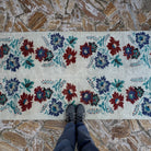1970s beige Turkish authentic vintage runner rug with floral design, hand-knotted weave and low pile.
