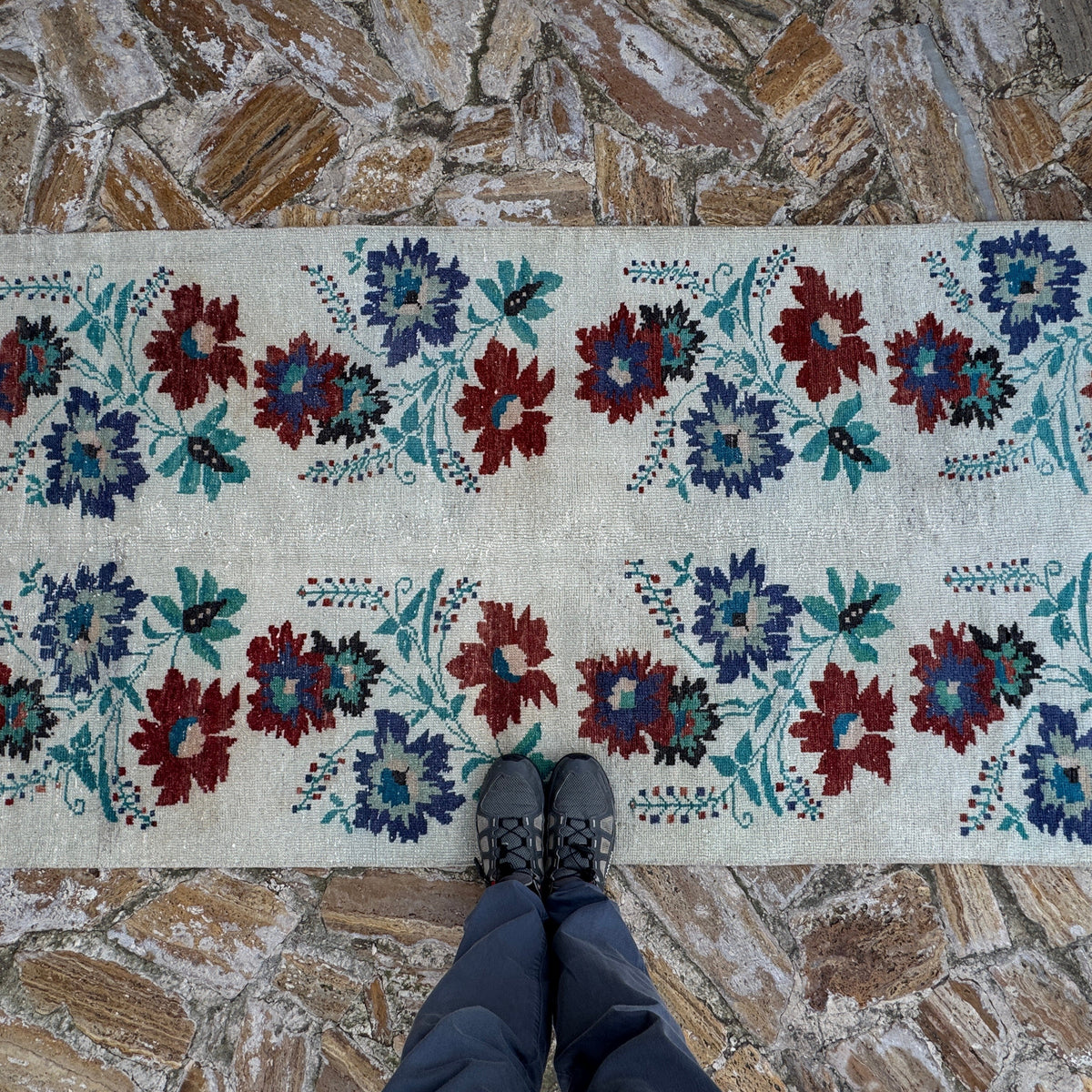 1970s beige Turkish authentic vintage runner rug with floral design, hand-knotted weave and low pile.