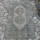 Beige 3' x 6' Turkish distressed rug in wool and cotton, shown on the floor.