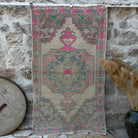 Pink 4' x 7' distressed rug with traditional design, handmade in Turkey – Cora.