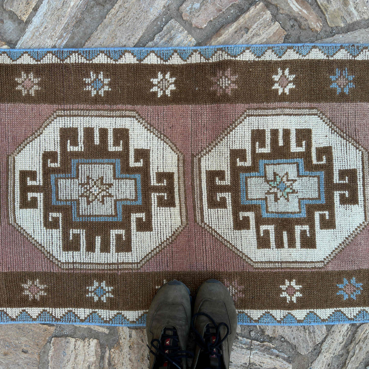1970s brown Turkish distressed runner rug with oushak design, hand-knotted weave and low pile.