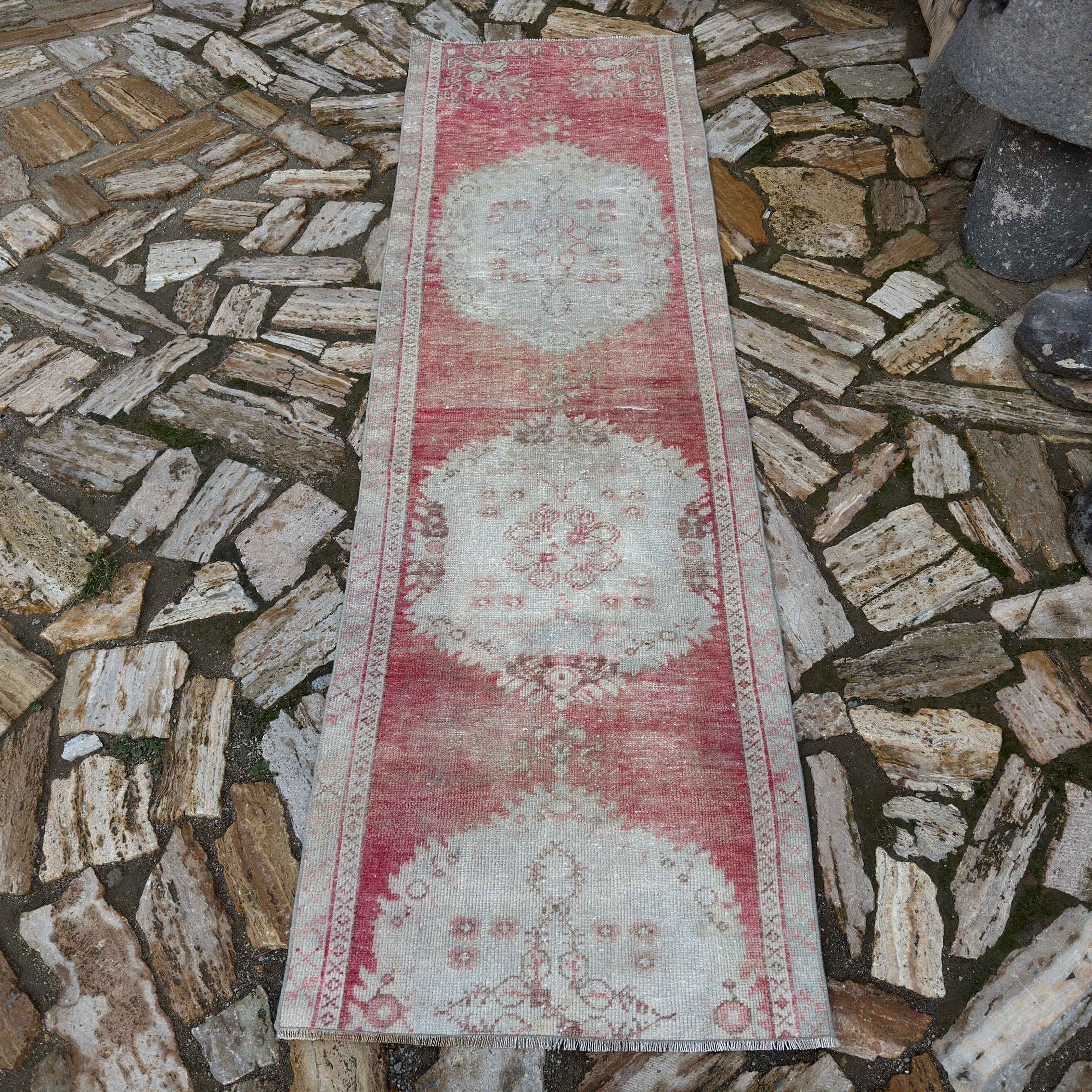 Pale Red 3' x 8' Turkish distressed runner rug in wool and cotton, shown on the floor.