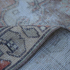 Additional view of the red distressed turkish rug, hand-knotted in wool and cotton.