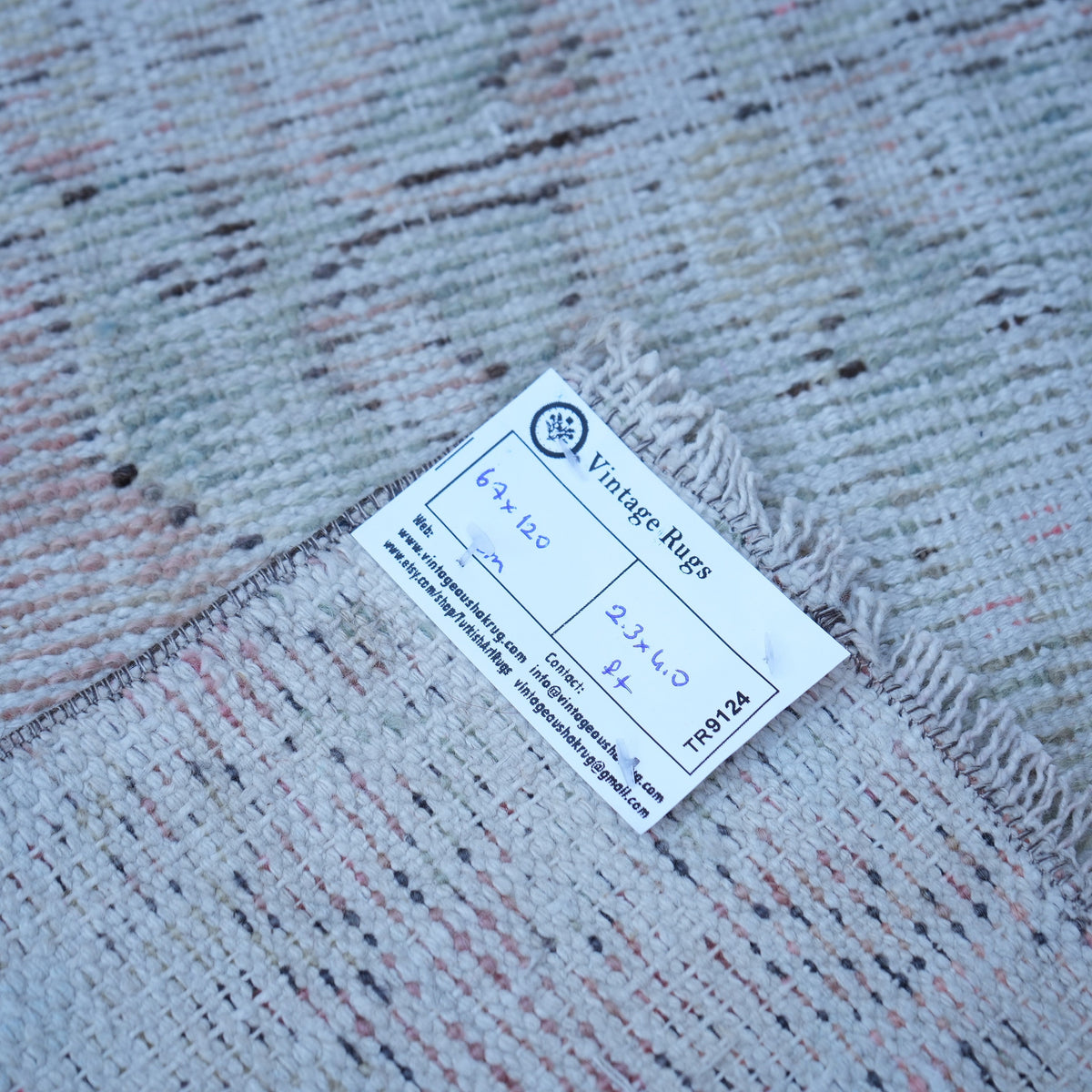 Pink 2' x 4' Turkish distressed vintage rug from the 1970s with traditional design.