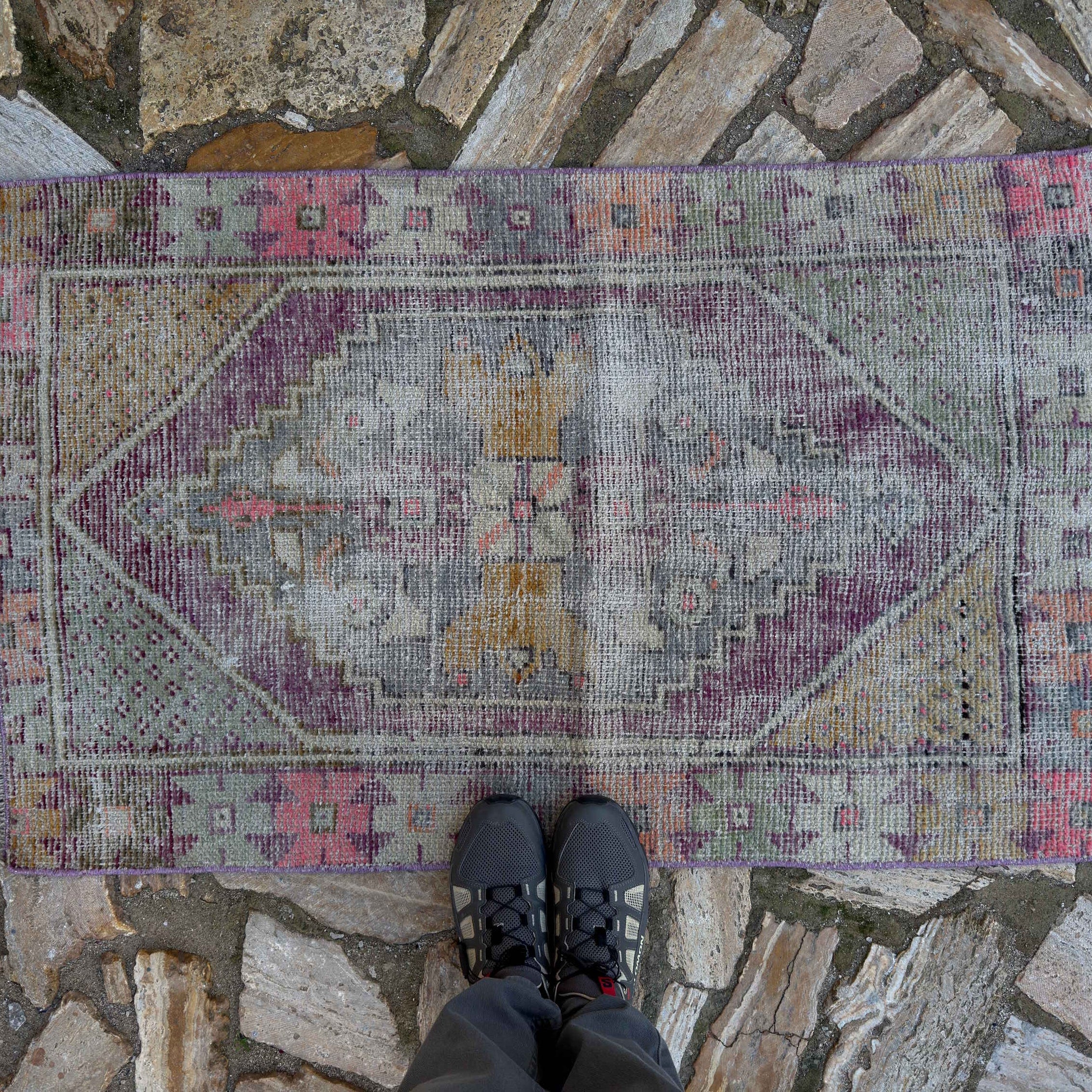 1970s pale purple Turkish distressed vintage rug with traditional design, hand-knotted weave and low pile.
