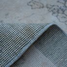 Additional view of the beige Turkish distressed vintage rug, hand-knotted in wool and cotton.