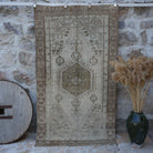 Brown 4' x 7' distressed vintage rug with traditional design, handmade in Turkey – Taryn.