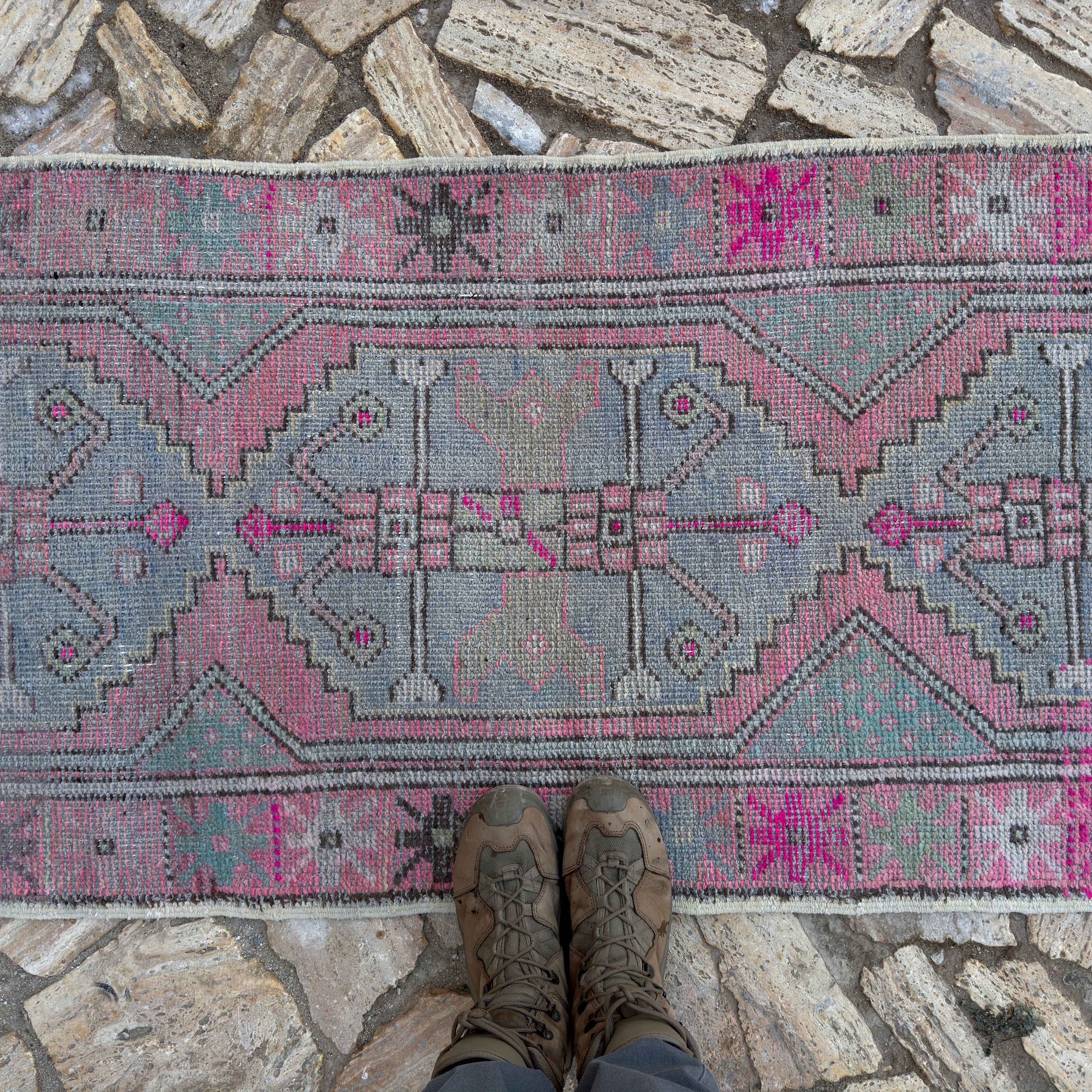 1970s pink Turkish distressed vintage runner with traditional design, hand-knotted weave and low pile.