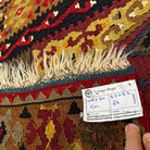 Close-up of the red Turkish flatweave rug showing traditional details, flatweave construction, wool and cotton and low pile.