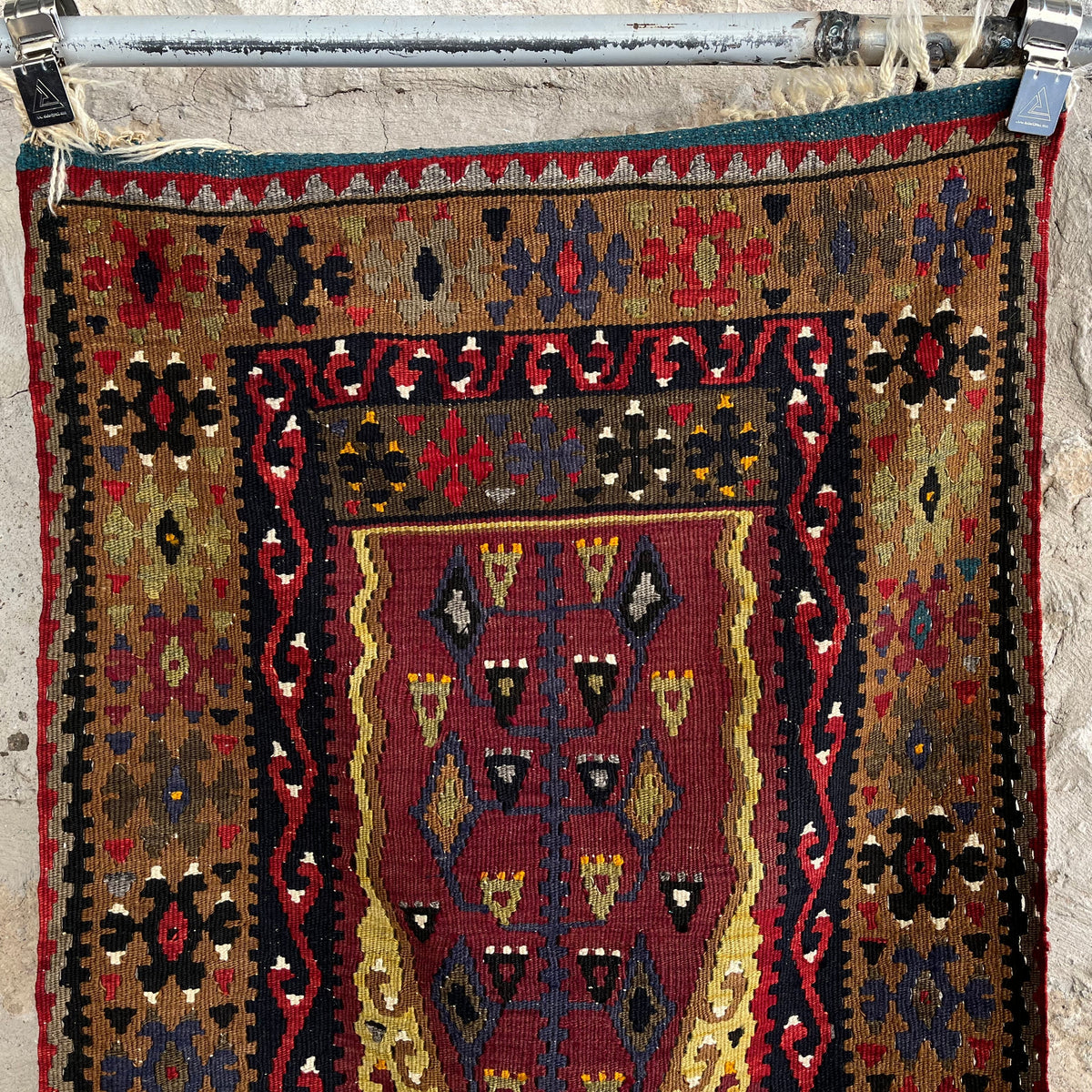 Red 2' x 4' Turkish flatweave rug in wool and cotton, shown on the floor.
