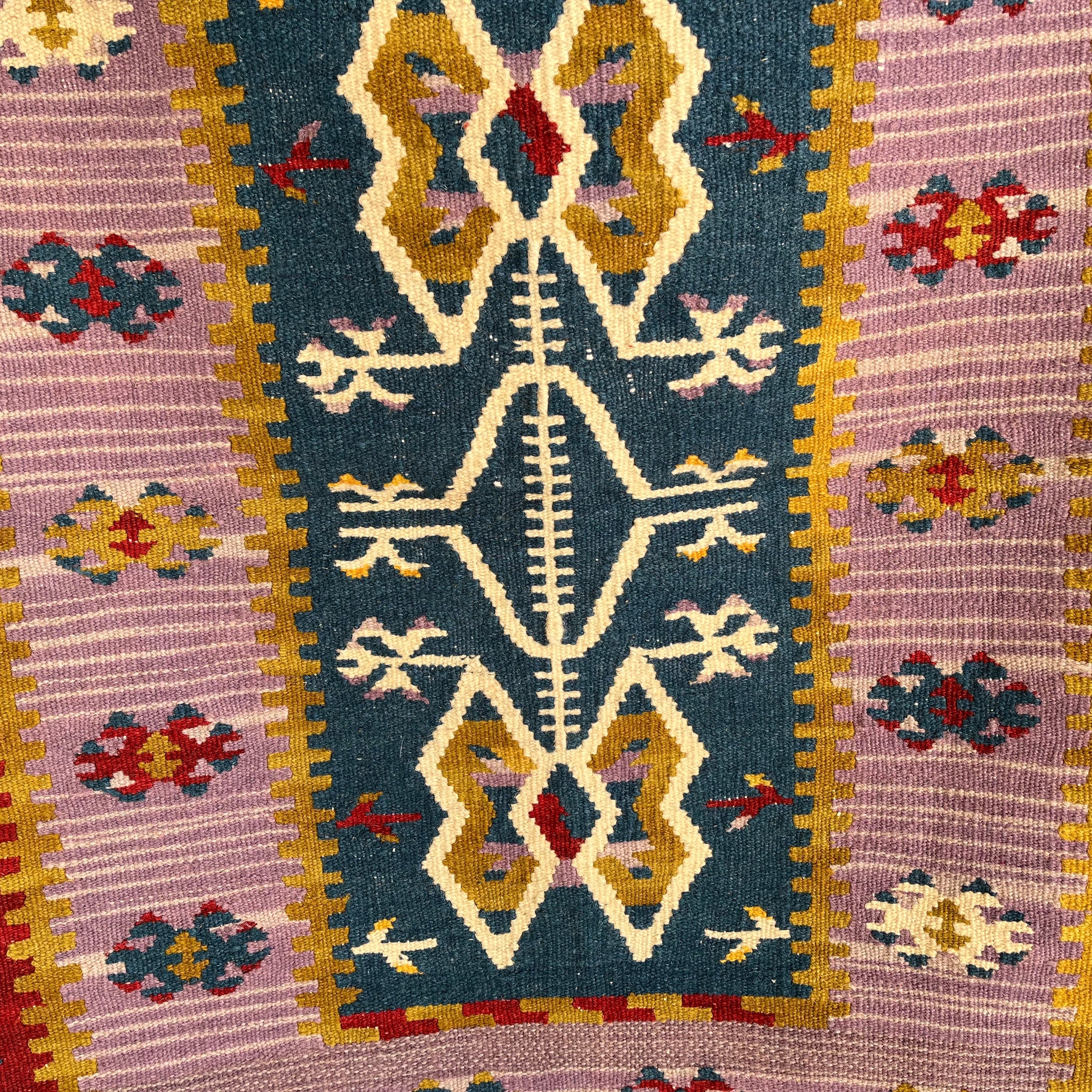 Close-up of the blue Turkish flatweave rug showing traditional details, flatweave construction, wool and cotton and low pile.