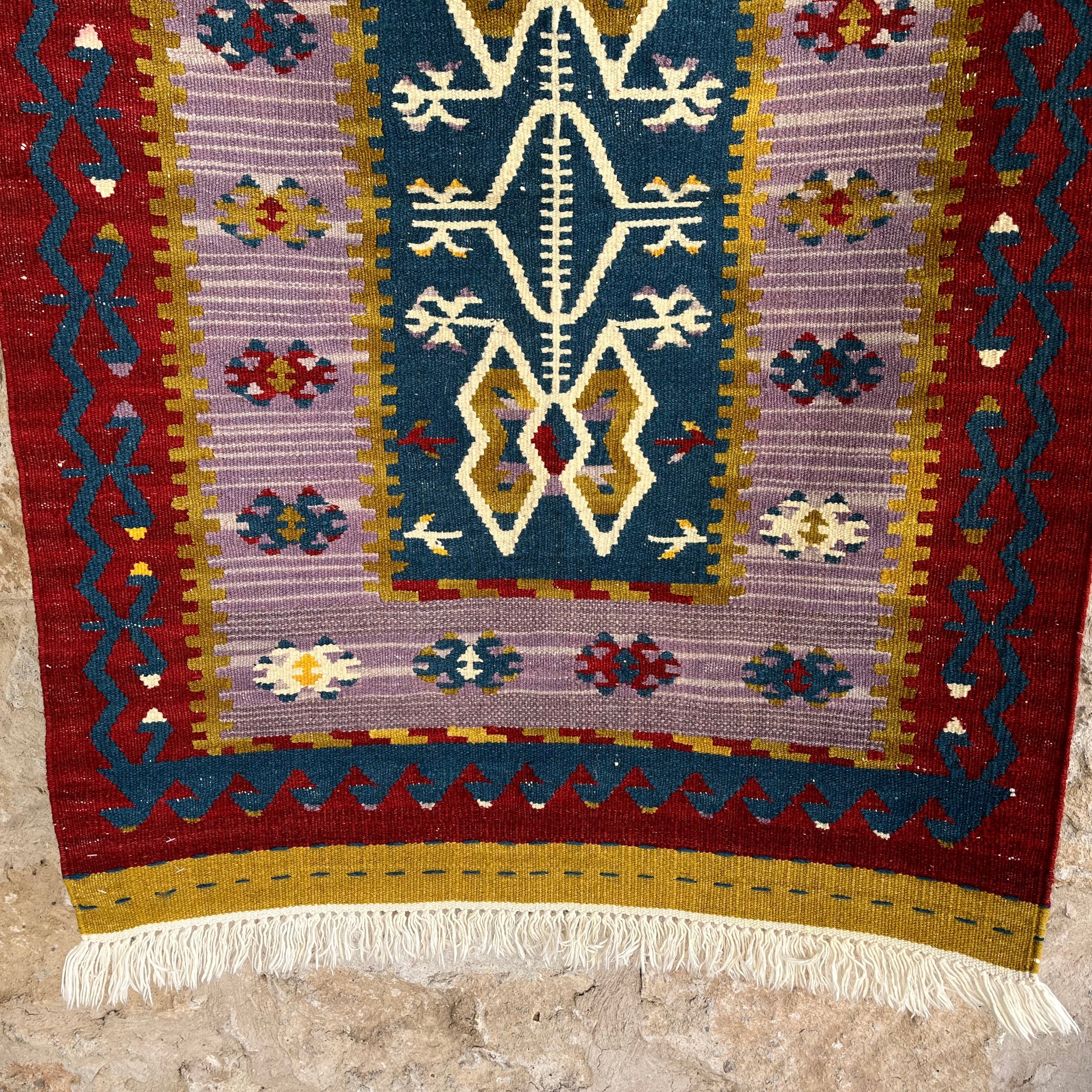 Blue 3' x 4' Turkish flatweave rug in wool and cotton, shown on the floor.