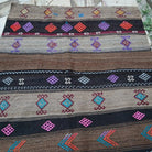 Brown 4' x 5' Turkish flatweave rug in wool and cotton, shown on the floor.