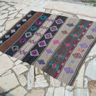 Brown 4' x 6' Turkish flatweave rug in wool and cotton, shown on the floor.