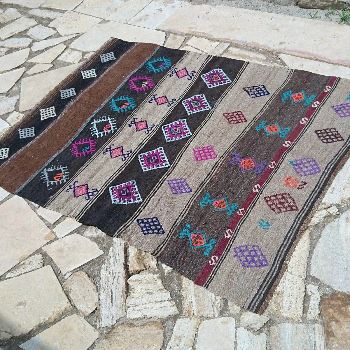 Brown 4' x 6' Turkish flatweave rug in wool and cotton, shown on the floor.