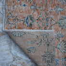 1970s orange Turkish floral runner rug with floral design, hand-knotted weave and low pile.