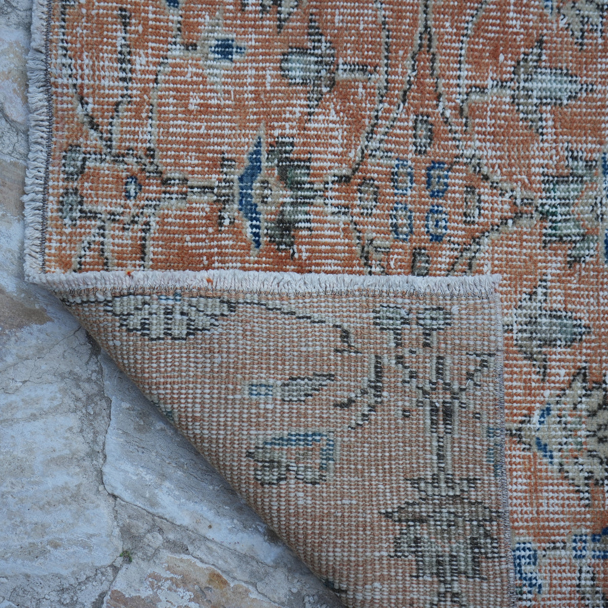1970s orange Turkish floral runner rug with floral design, hand-knotted weave and low pile.