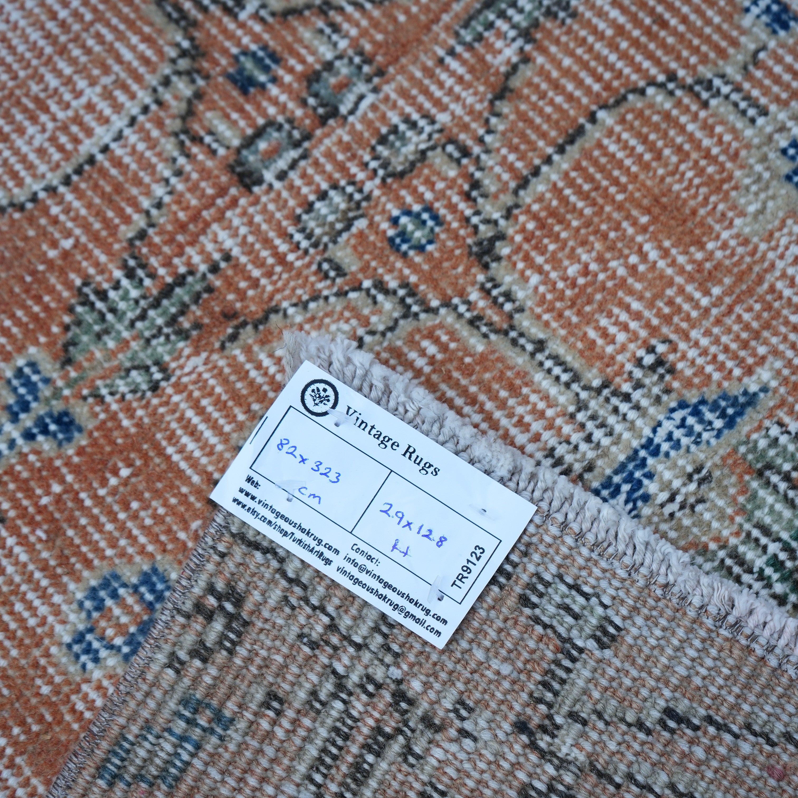 Orange 3' x 11' Turkish floral runner rug from the 1970s with floral design.