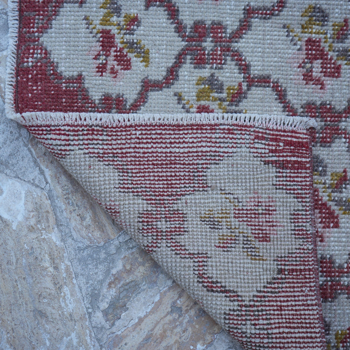 1970s red floral turkish rug with floral design, hand-knotted weave and low pile.