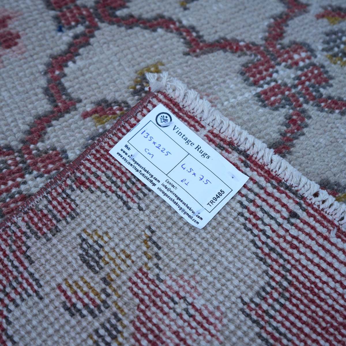 Red 4' x 7' floral turkish rug from the 1970s with floral design.
