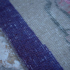 Beige 4' x 7' Turkish floral vintage rug in wool and cotton, shown on the floor.