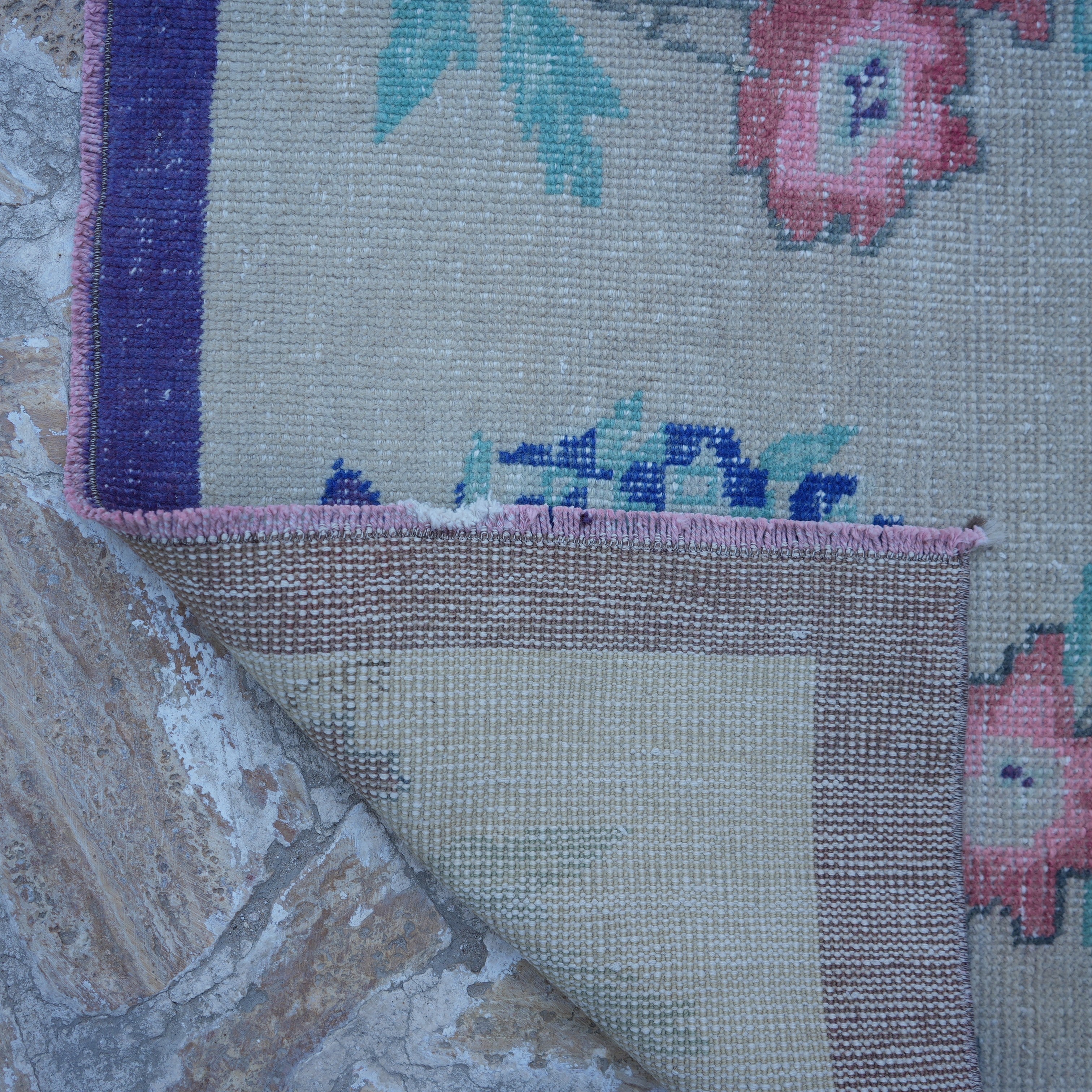 1970s beige Turkish floral vintage rug with floral design, hand-knotted weave and low pile.