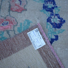 Beige 4' x 7' Turkish floral vintage rug from the 1970s with floral design.