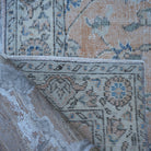 1970s orange Turkish floral vintage rug with floral design, hand-knotted weave and low pile.