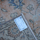 Orange 4' x 7' Turkish floral vintage rug from the 1970s with floral design.