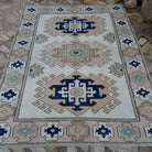 Pale Pink 6' x 8' Turkish geometric area carpet in wool and cotton, shown on the floor.