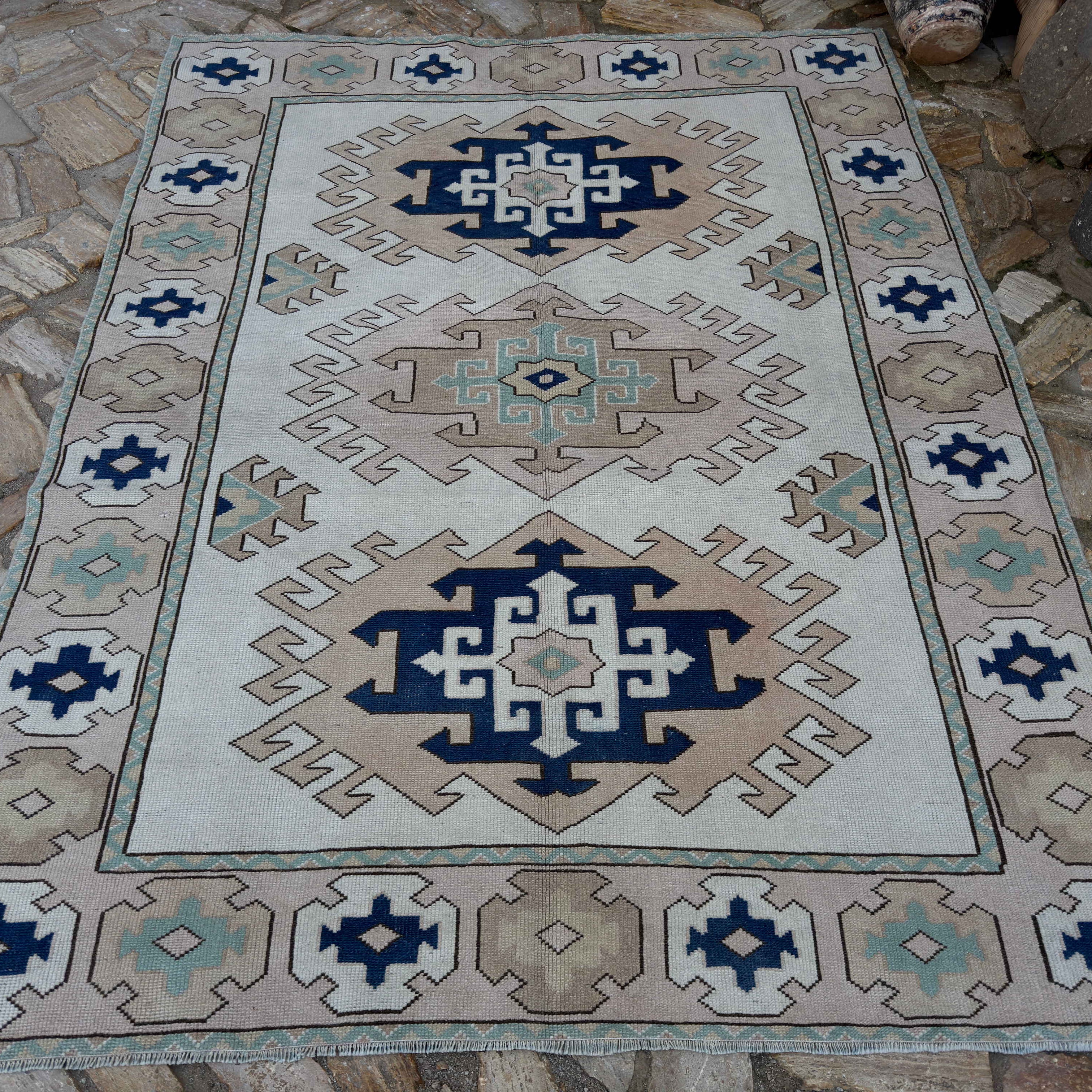 Pale Pink 6' x 8' Turkish geometric area carpet in wool and cotton, shown on the floor.