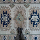 1970s pale pink Turkish geometric area carpet with neutral design, hand-knotted weave and low pile.