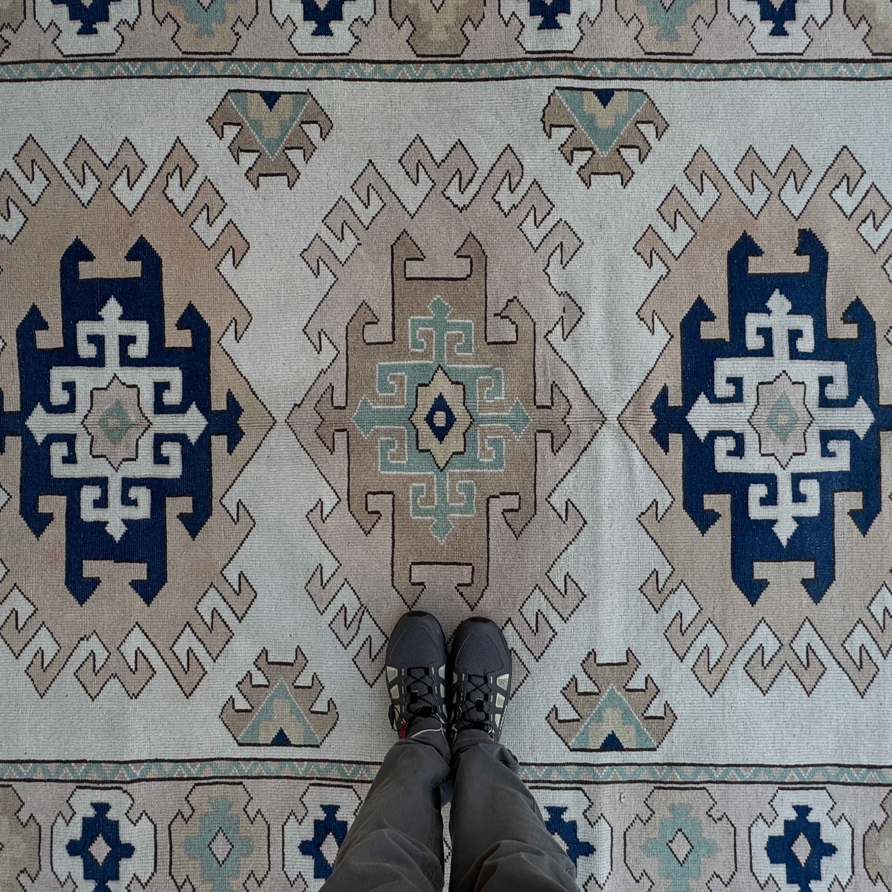1970s pale pink Turkish geometric area carpet with neutral design, hand-knotted weave and low pile.