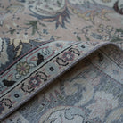 Pink 8' x 12' hand-knotted persian rug from the 1970s with medallion design.