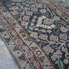 1970s pink hand-knotted persian rug with medallion design, hand-knotted weave and low pile.