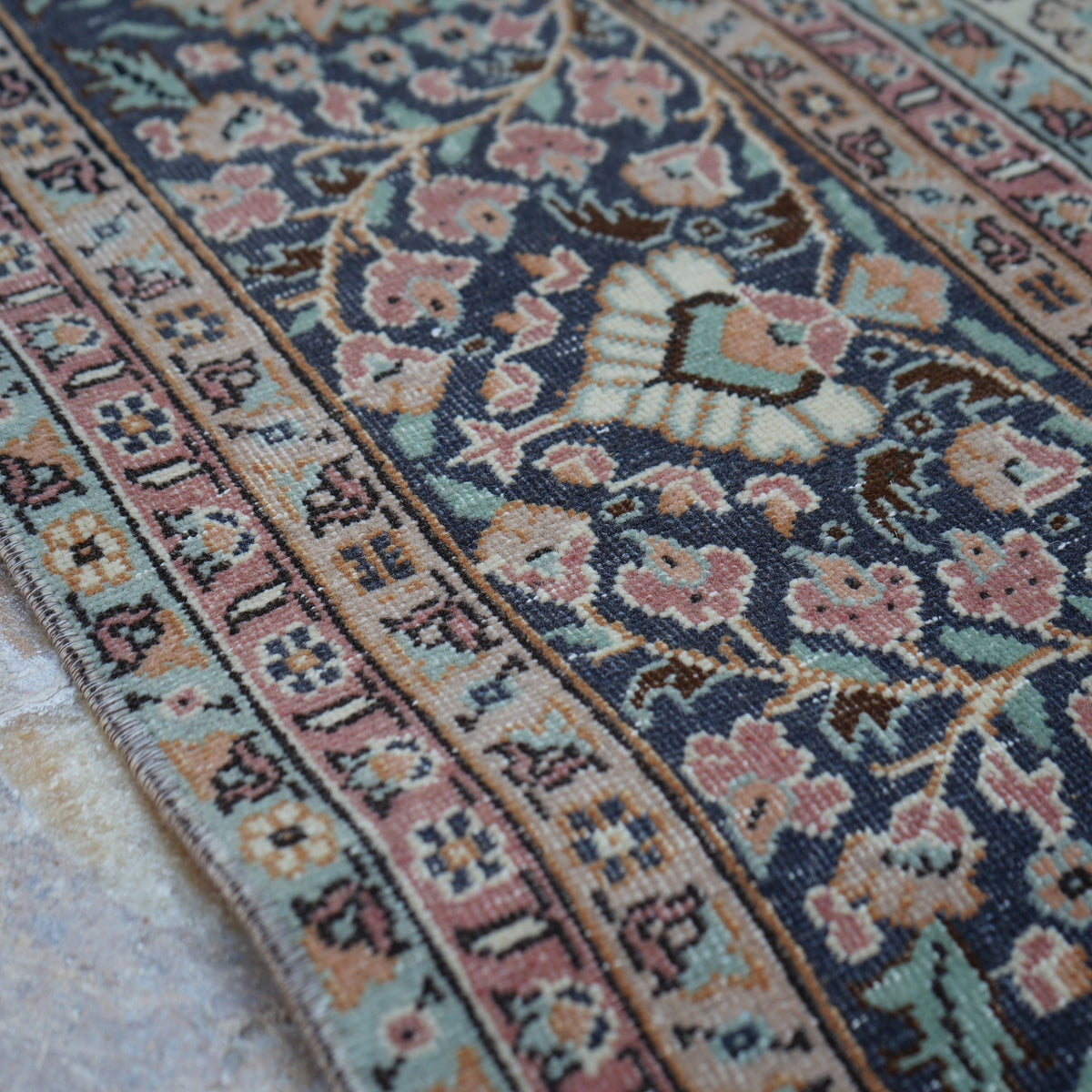 1970s pink hand-knotted persian rug with medallion design, hand-knotted weave and low pile.