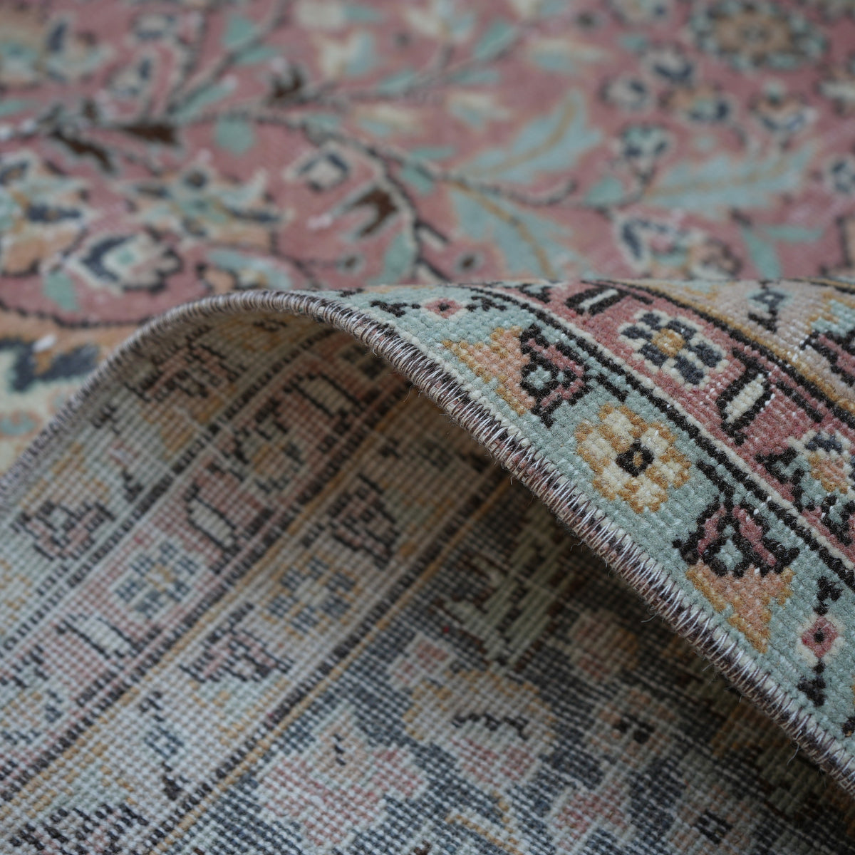 Pink 8' x 13' hand-knotted persian rug from the 1970s with medallion design.