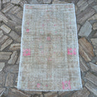 Beige 3' x 4' Turkish hand-knotted rug in wool and cotton, shown on the floor.
