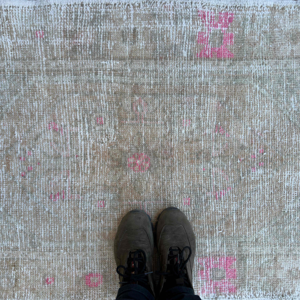 1970s beige Turkish hand-knotted rug with neutral design, hand-knotted weave and low pile.