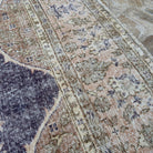 1970s blue Turkish hand-knotted vintage rug with medallion design, hand-knotted weave and low pile.