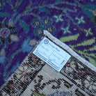 Purple 5' x 8' Turkish handknotted floral rug from the 1970s with floral design.
