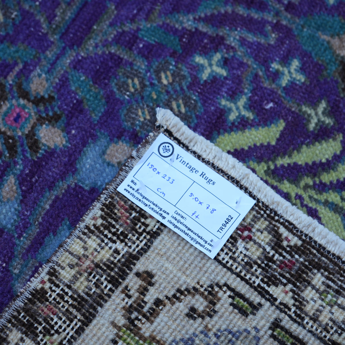 Purple 5' x 8' Turkish handknotted floral rug from the 1970s with floral design.