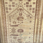 Pink 3' x 6' Turkish handknotted rug in wool and cotton, shown on the floor.