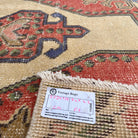Close-up of the blue Turkish handknotted rug showing traditional details, hand-knotted weave, wool and cotton and low pile.