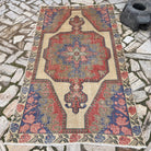 Blue 4' x 7' Turkish handknotted rug in wool and cotton, shown on the floor.